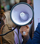 Close up of hand holding a megaphone