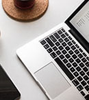 Close-up of laptop keyboard on white table