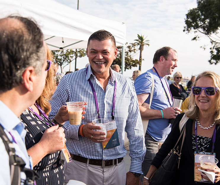 Group of nonprofit professionals smiling at outdoor event