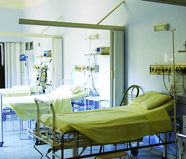 A row of empty hospital beds